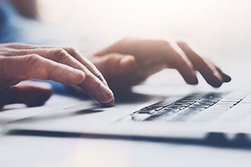 person typing on keyboard
